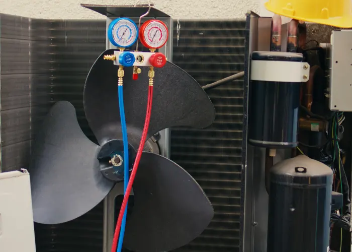 An AC unit being repaired after being opened